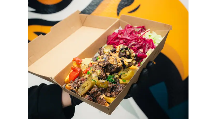 Loaded fries topped with beef and cheddar sauce